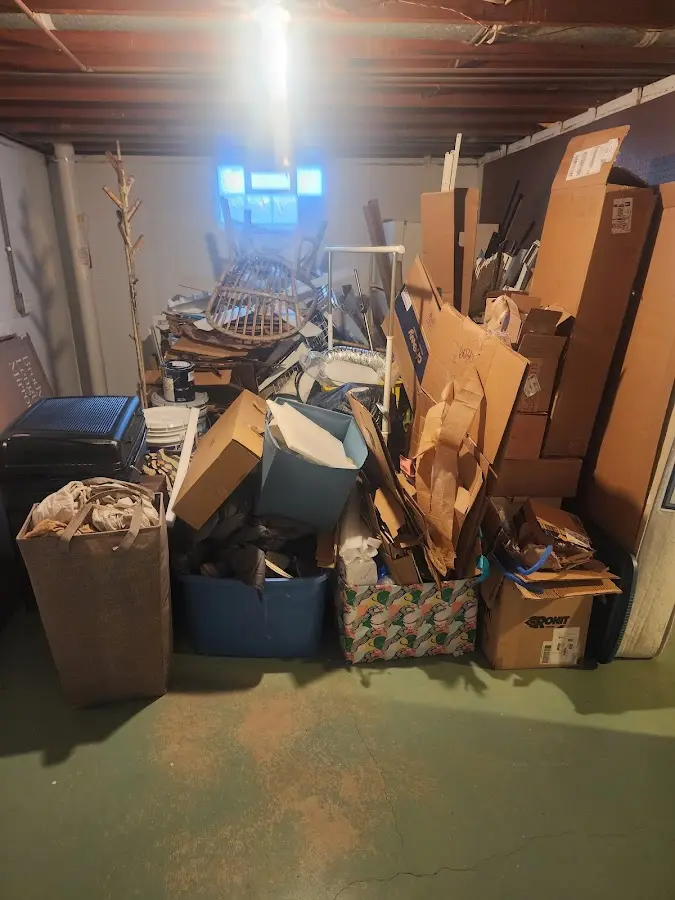 Roll-off dumpster container at job site for Yard Waste Dumpster Rental in Stoughton